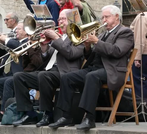 Playing those instruments puts a lot of pressure on the teeth. Will it displace them? Only if you do it lots of hours every day.