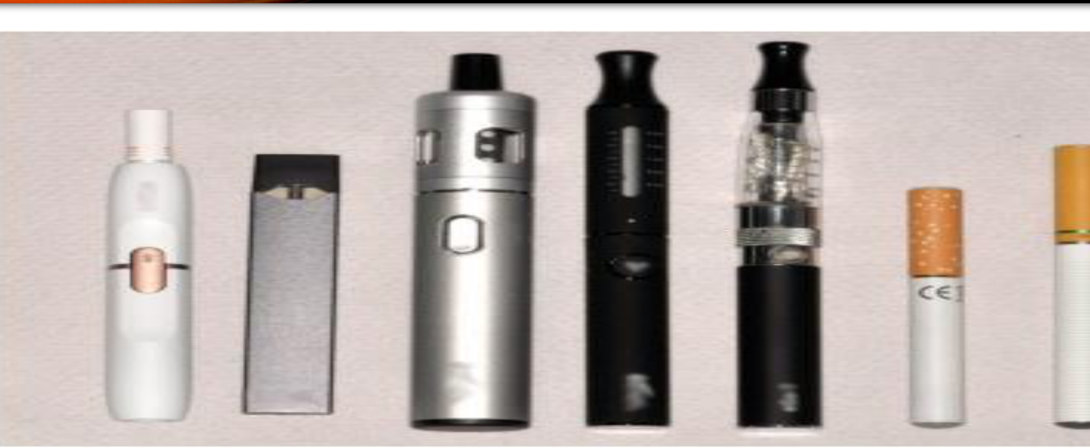 Figure 1. E-cigarette and heated tobacco devices in a range of designs. From right, two early devices that resemble a tobacco cigarette, so called 'cigalikes'; three 'tank' device which are refillable with e-liquids and rechargeable; a much smaller device that resembles an USB drive and uses nicotine salt technology; finally, a heated tobacco product with the tobacco stick in place.