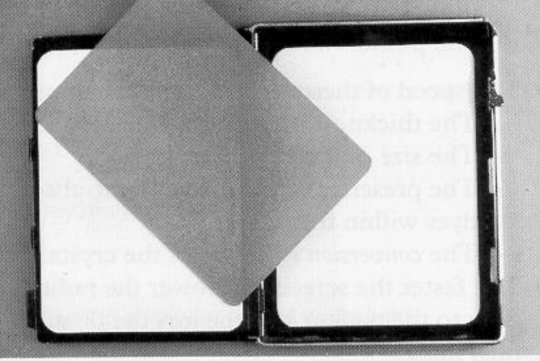 Fig. 5.21A A standard 18 × 13 cm cassette opened up showing the white intensifying screens and the film.